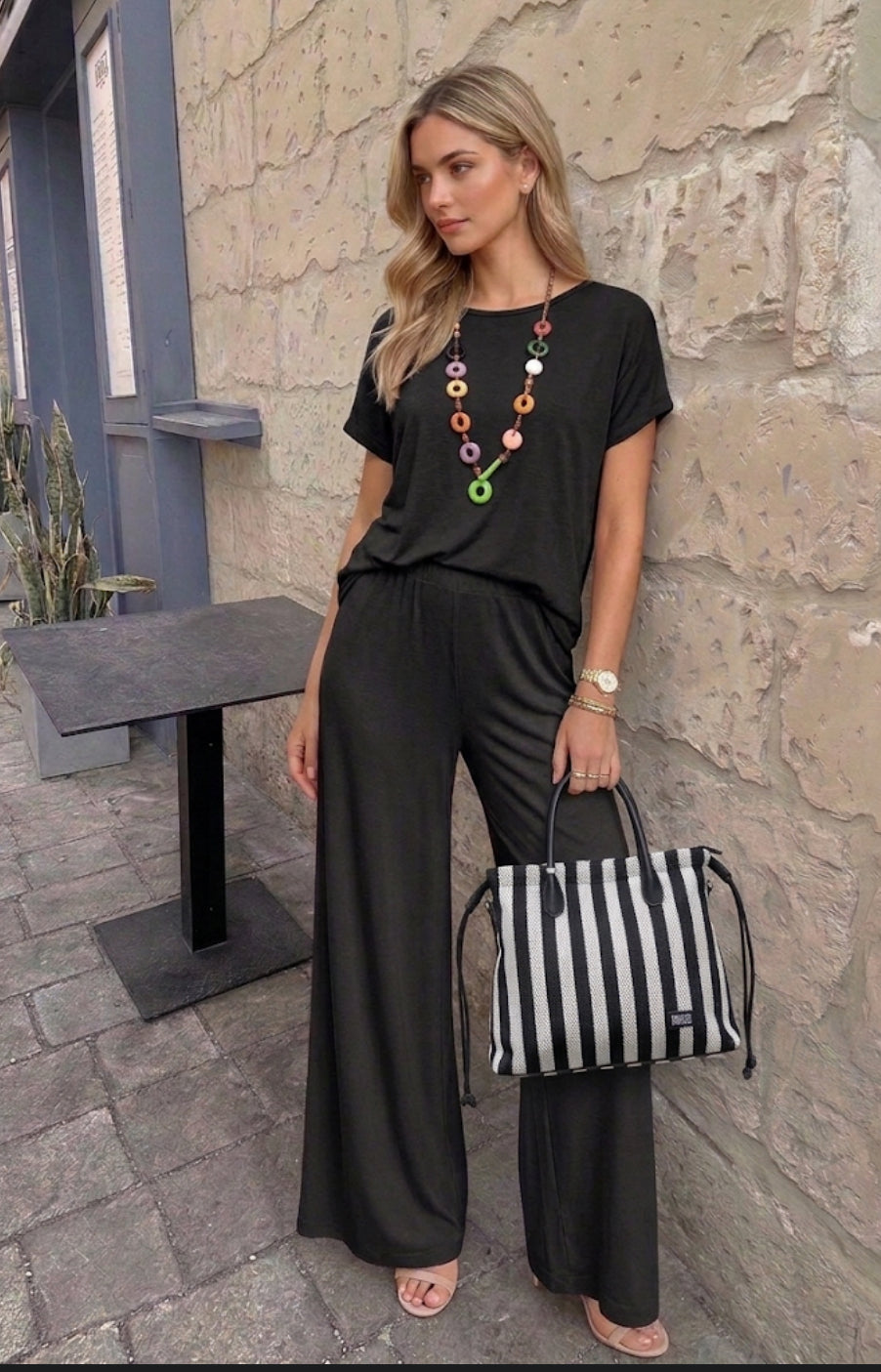 Tuta donna completo maglia girocollo e pantalone a palazzo