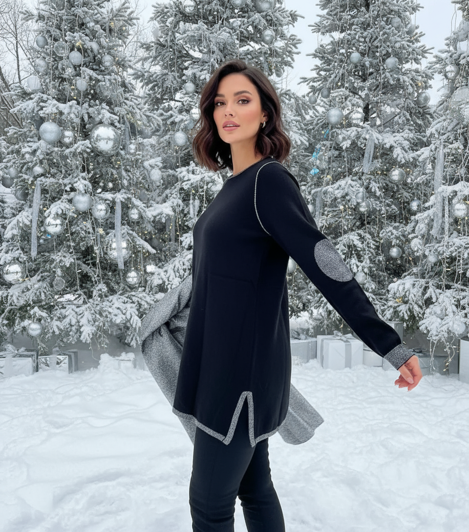 Donna con maglia nera in posa dinamica