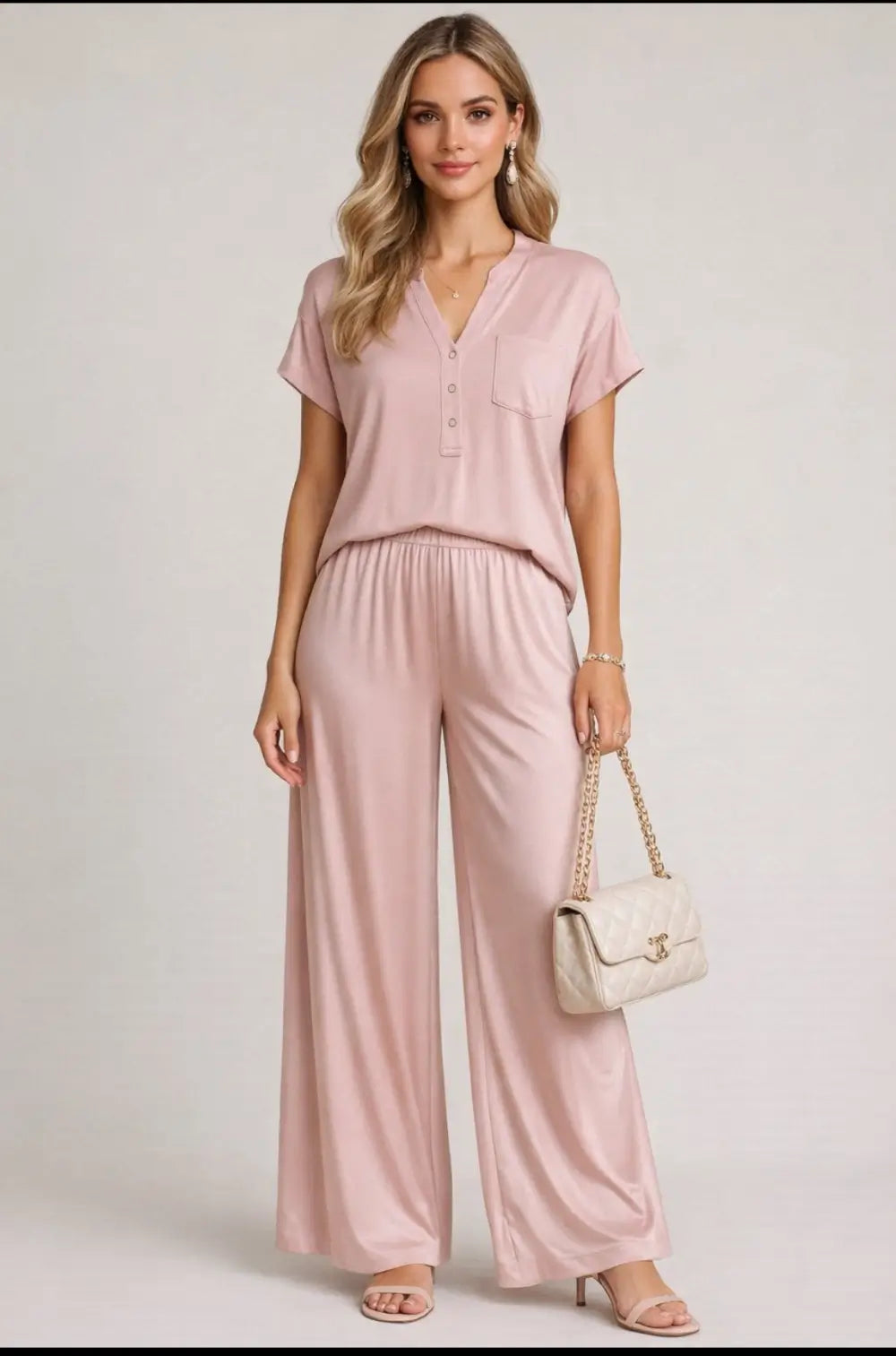 tuta donna rosa completo maglia e pantaloni a palazzo